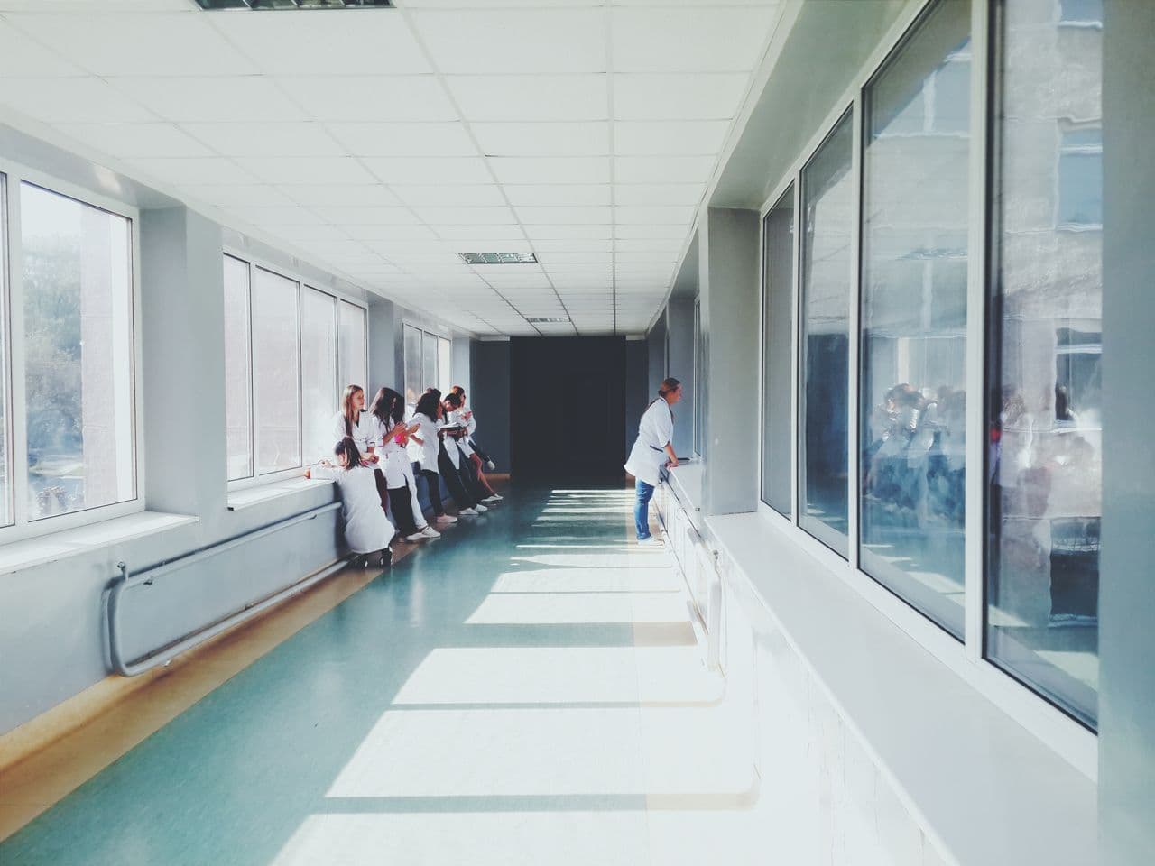 Clinicians walking a hospital corridor on a ward round