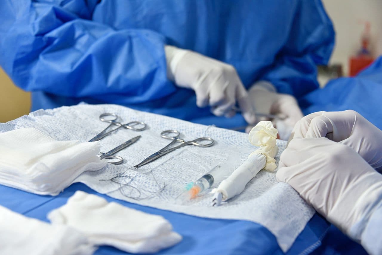 Sterile surgical instruments laid out on a theatre tray