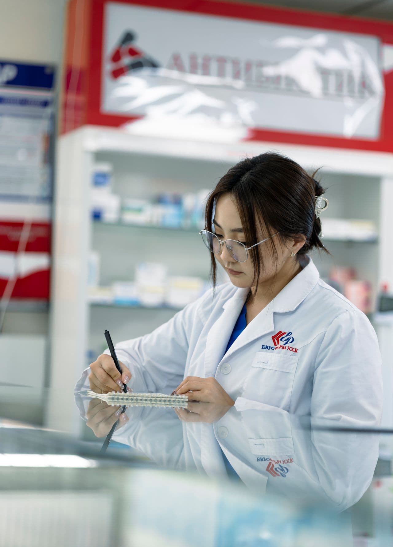 Pharmacist preparing medication in a hospital pharmacy
