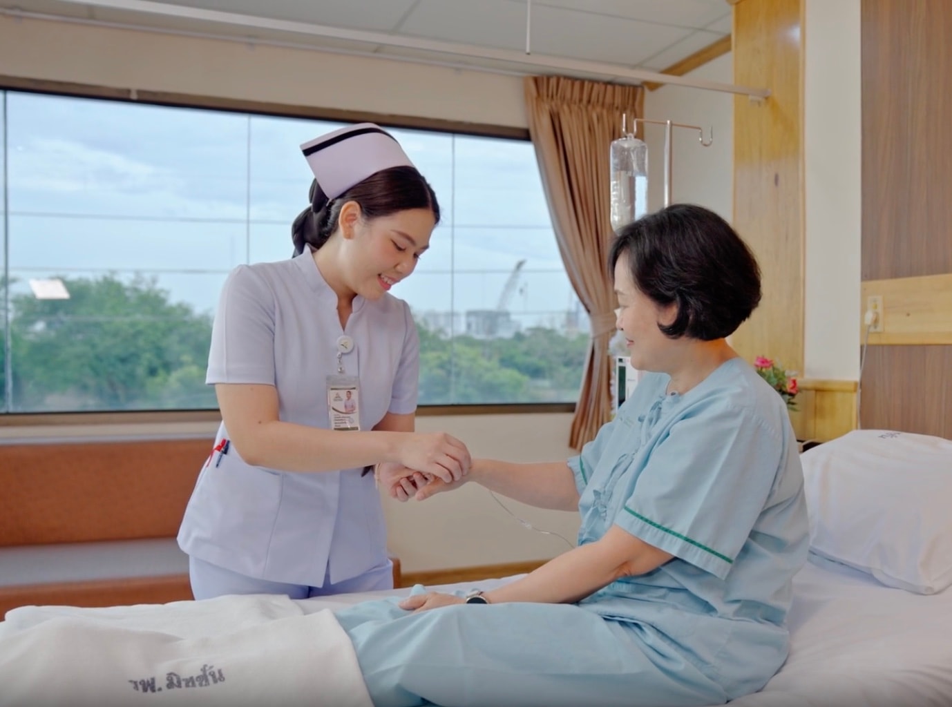 Nurse caring for an elderly woman